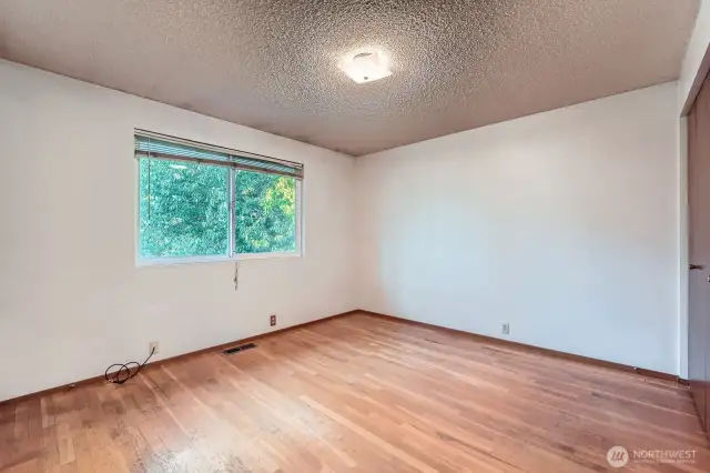 Main bedroom with hardwood floors