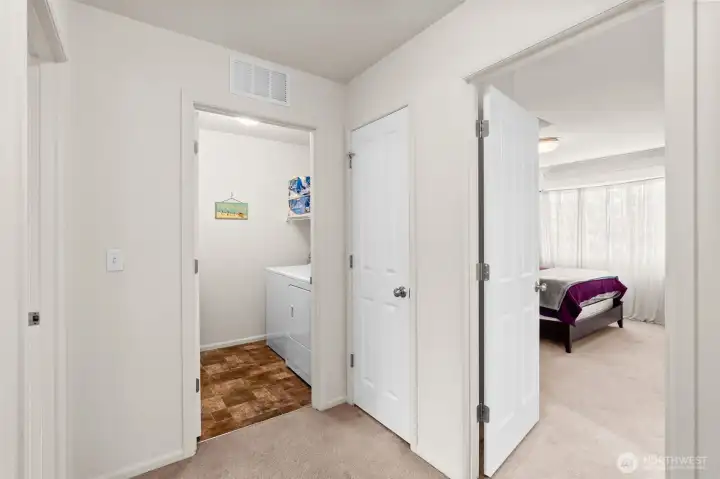 Upstairs, left door front bedroom, middle laundry room, right door back bedroom