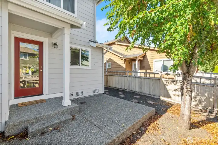 Fully fenced backyard with patio