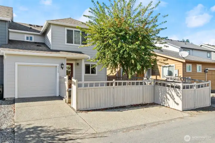 One car garage located behind home