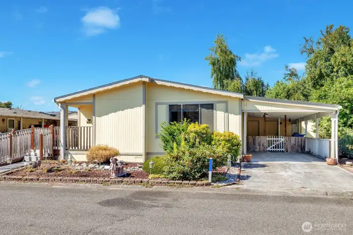 Level entry into the home at the utility room access door from the covered carport area.