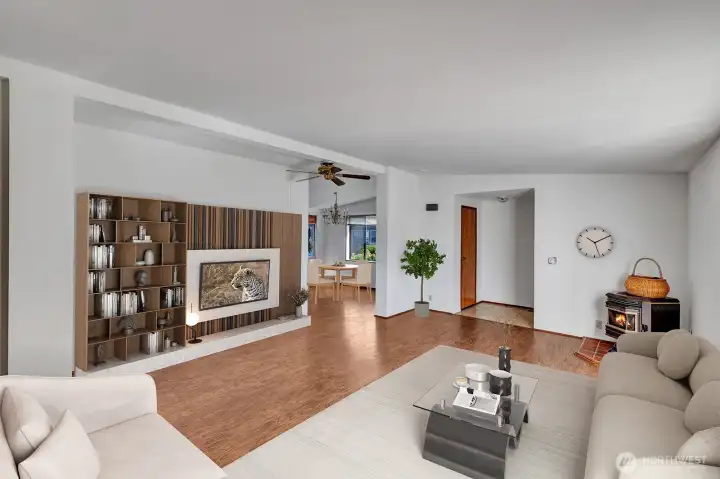 Formal living room area. Pellet stove in corner for those chilly fall and winter days. Easy care laminet flooring.   Room is virtually staged.