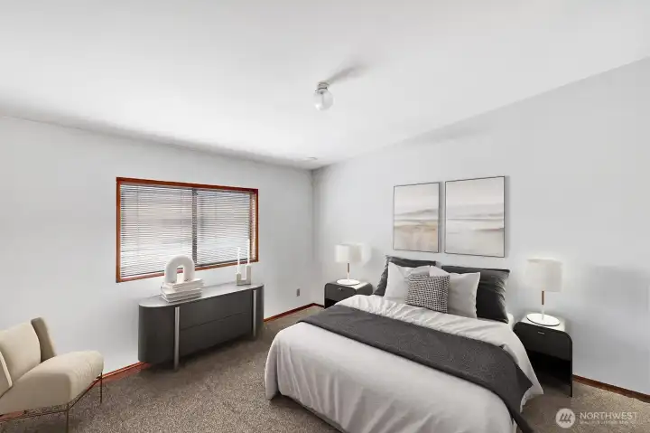 Primary is located at the back of the home. Room for King size bed and additional furniture. Open step in closet area. Virtually staged