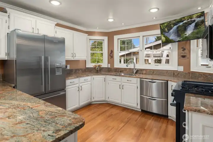 Newer stainless appliances. Large capacity refrigerator, double drawer dishwasher and Beco range. Gleaming hardwoods.