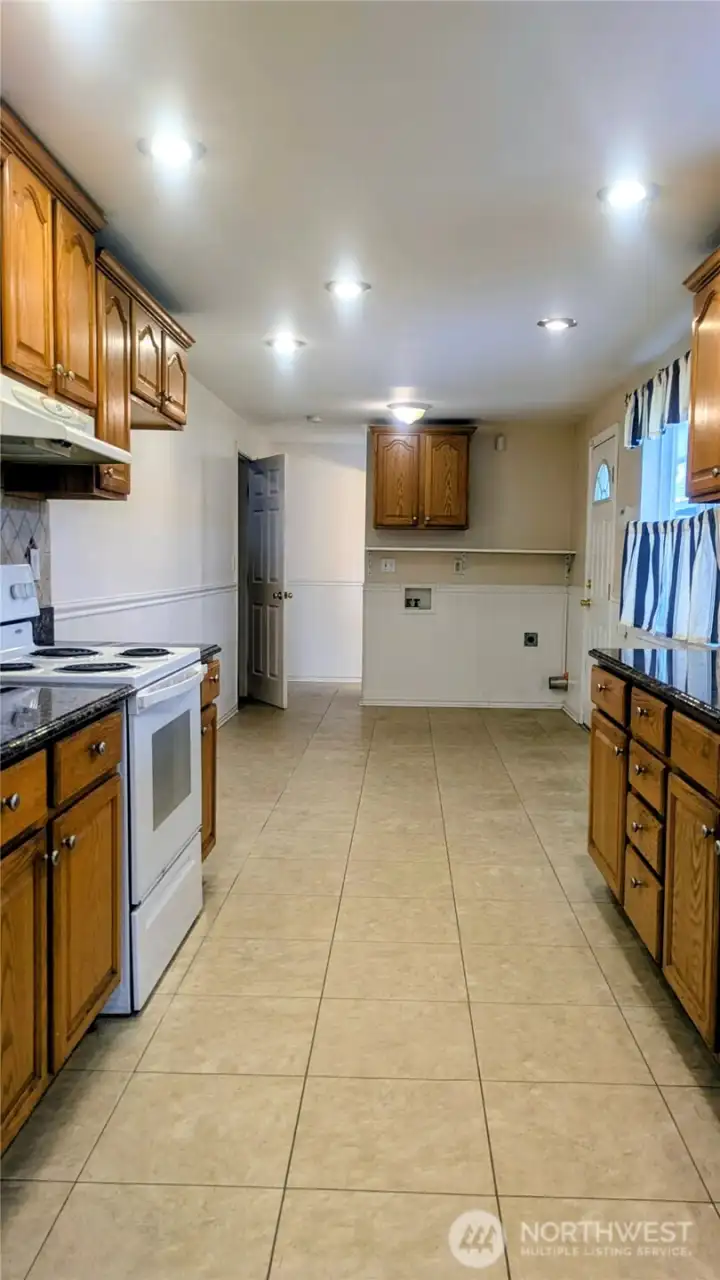 from kitchen to upstairs/half bath/laundry area and garage