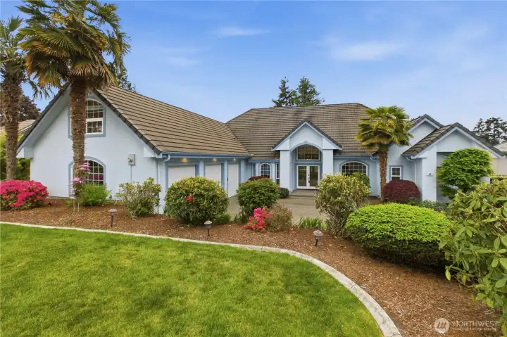 Beautiful rambler with meticulously manicured landscaping.