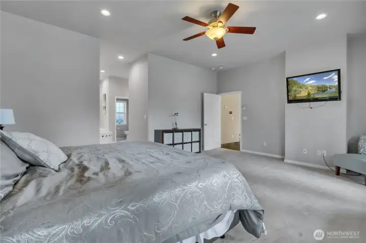 Another view of the spacious primary suite, showcasing its relaxing atmosphere and thoughtful design.