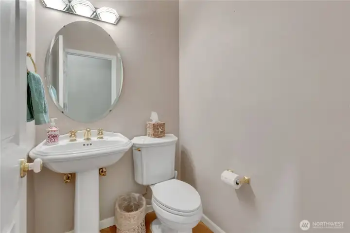 Conveniently located powder room for guests, offering ease and accessibility.