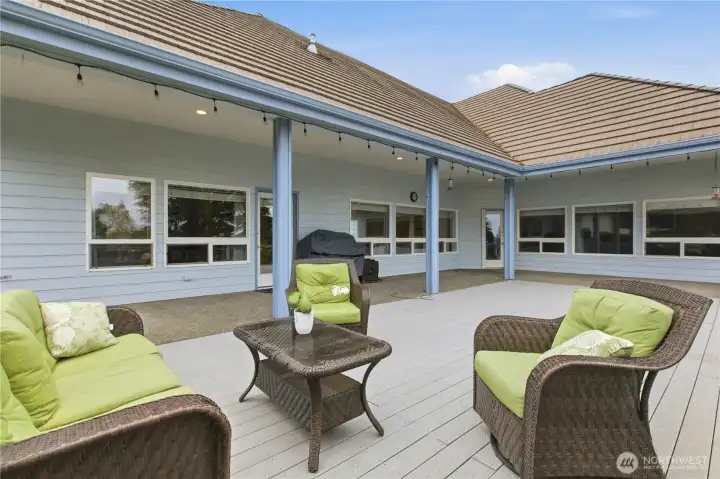 The deck serves as the entertainer’s hub of the home, perfect for gatherings, relaxation, and enjoying the outdoors.
