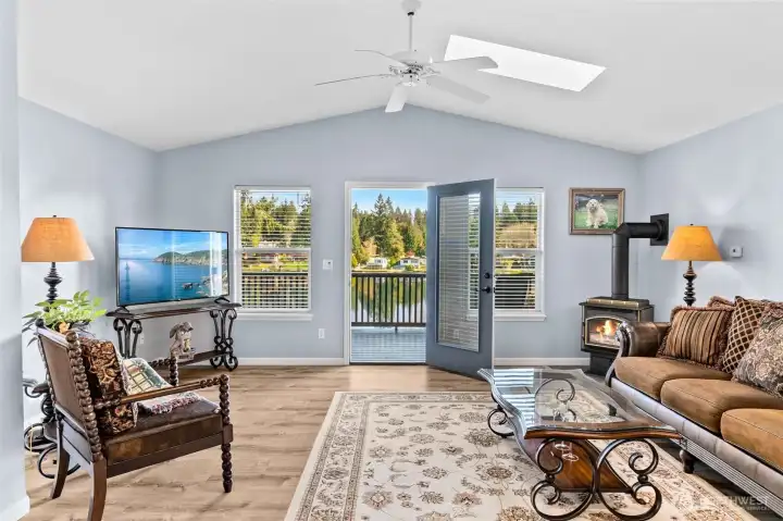 A cozy gas fireplace keeps the entire home warm and toasty in cooler months with wall heaters strategically placed as well. Step out to the expansive deck for serene views, a stunning sunrise with your morning coffee or a family of deer peacefully passing through.