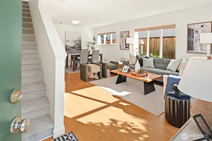 A surprisingly spacious floorplan bathed in natural light greets you at the formal entry.