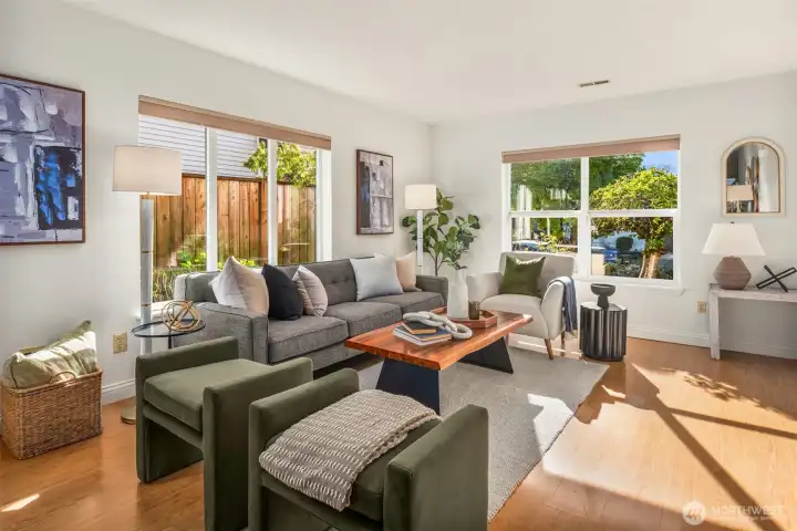 The living room is spacious with an enviable versatility allowing for many different furniture arrangements.