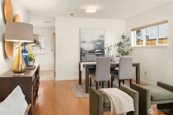 The living room flows easily into the dining area and kitchen with a high window allowing for a buffet or hutch.