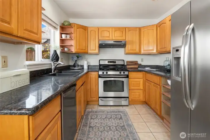 Great counterspace and an abundance of storage await your creative culinary dishes.