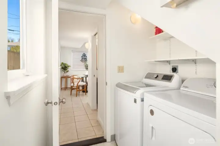 The full size laundry room is located quietly off the kitchen. The just-serviced gas furnace with central A/C is off to the right in a separate furnace room.