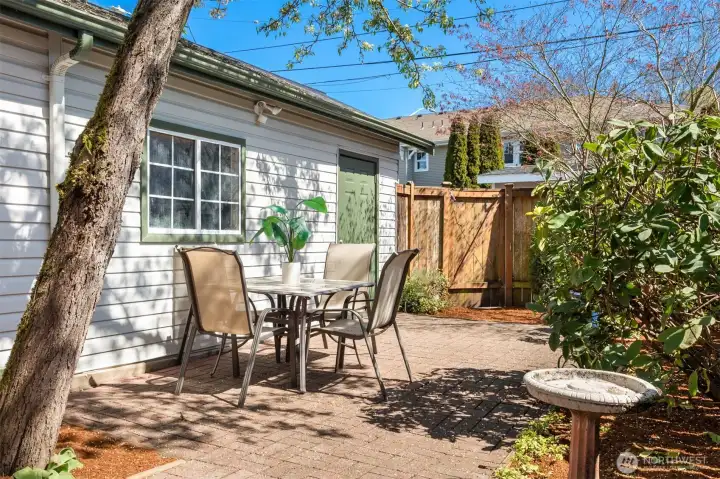 Looking back towards the man door to the garage and the back gate that leads to the private paved alley.