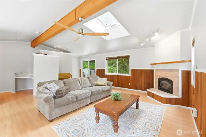 Comfortable living room featuring a gas fireplace, abundant natural light, and an easy-flow floor plan designed for everyday living. Comfortable living room featuring a gas fireplace, abundant natural light, and an easy-flow floor plan designed for everyday living.