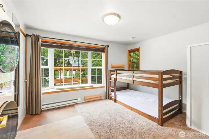 Spacious bedroom with plenty of natural light Spacious bedroom with plenty of natural light