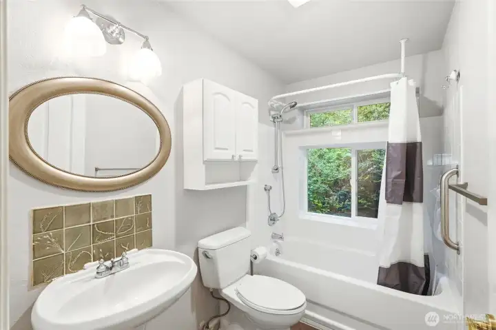 Second full bathroom is light and bright with window to greenspace. Second full bathroom is light and bright with window to greenspace.