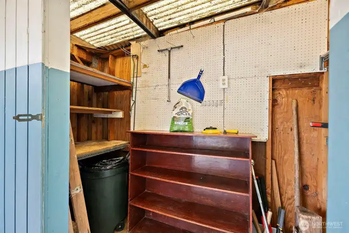 carport storage area with additional storage to the right side of the picture.