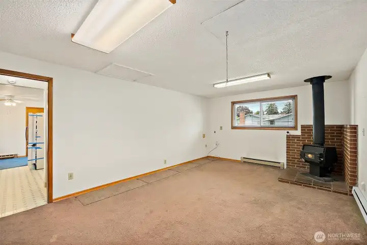 New carpet and paint, and you have a cozy room. Lots of natural light from the windows in this room. Above is the entry to the attic with a pull down ladder. The attic is finished and has lighting installed.