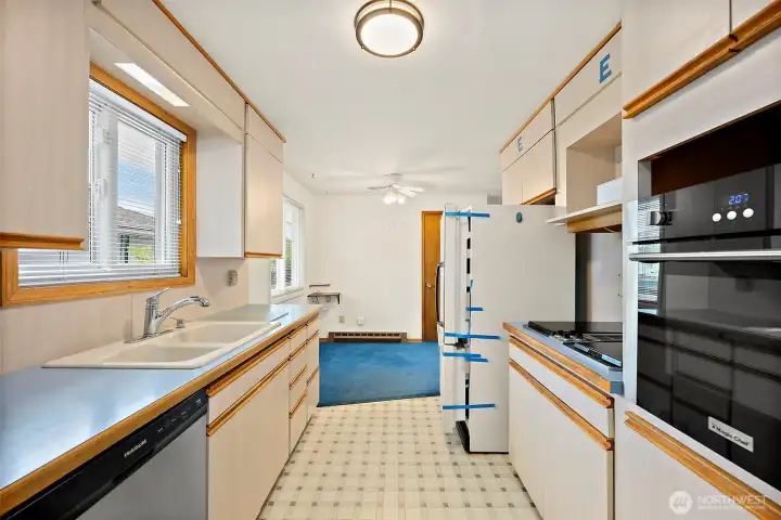 The kitchen is waiting for your remodeling ideas with plenty of space to work with.