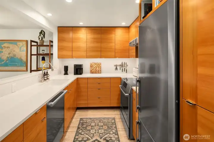 High-end stainless appliances include a Miele Futura dishwasher, Liebherr refrigerator and Bosch range.