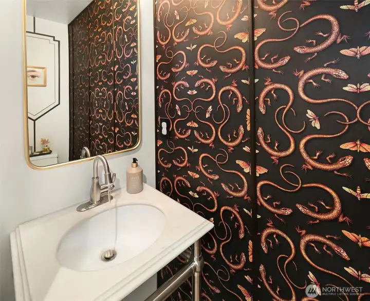 Cool powder room with a fun lighted faucet.