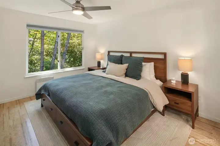Primary en suite bedroom easily accommodates a king bedroom set. And yes, the cork floors are upstairs too!