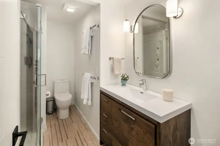 Primary bath with contemporary step-in shower.