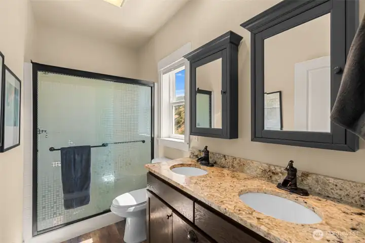 Primary bath with double sinks and shower.