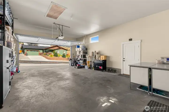 Finished garage with built-in storage units.