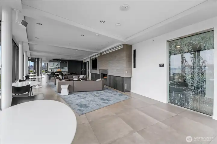 12th Floor Lounge area with fireplace and kitchn