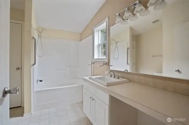 Big tub and lots of space in primary bathroom.