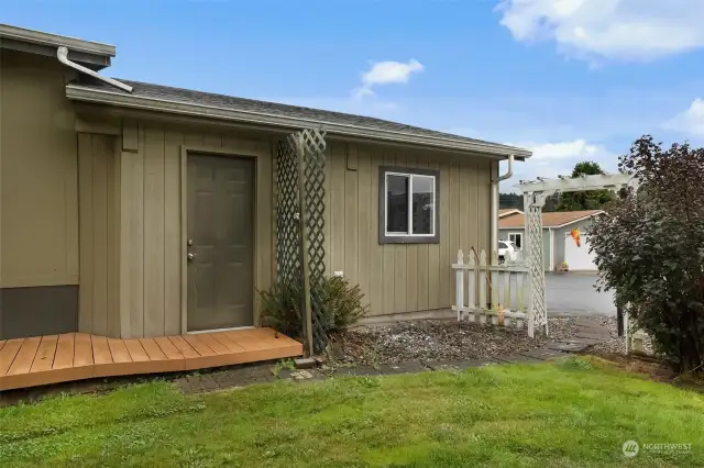 Garage has entry doors from both sides.