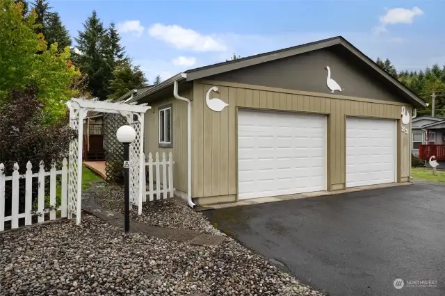 Back side of the home, there is a nice garden area and a walkway.