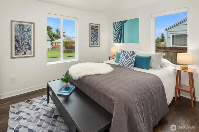 One of two main floor bedrooms with gorgeous floors and natural light.