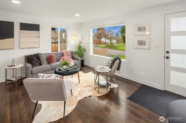 Light filled living room with can lighting. Double paned windows keep you cozy. Little and big upgrades wherever you look!