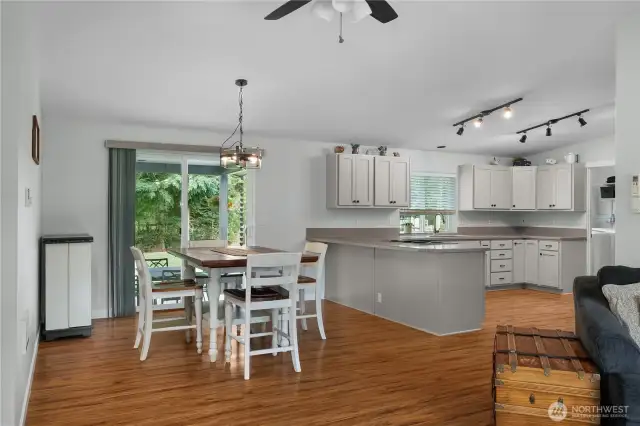 Open concept with eat-in and dining room options.