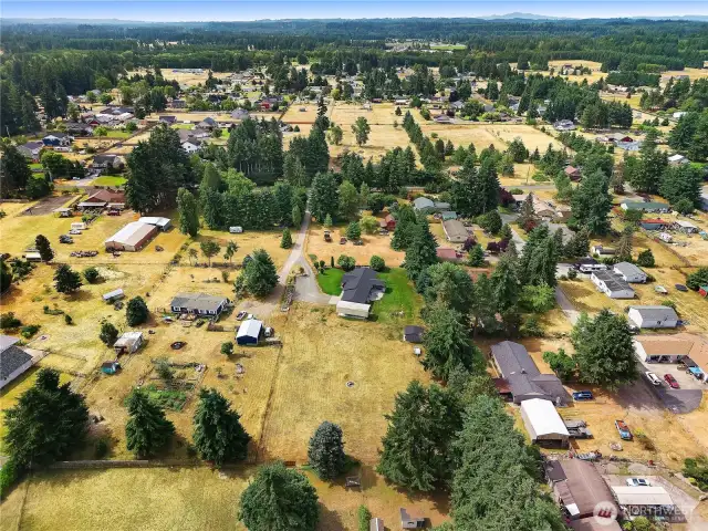A beautiful aerial view showcasing large lots, tree-lined streets, and peaceful surroundings.