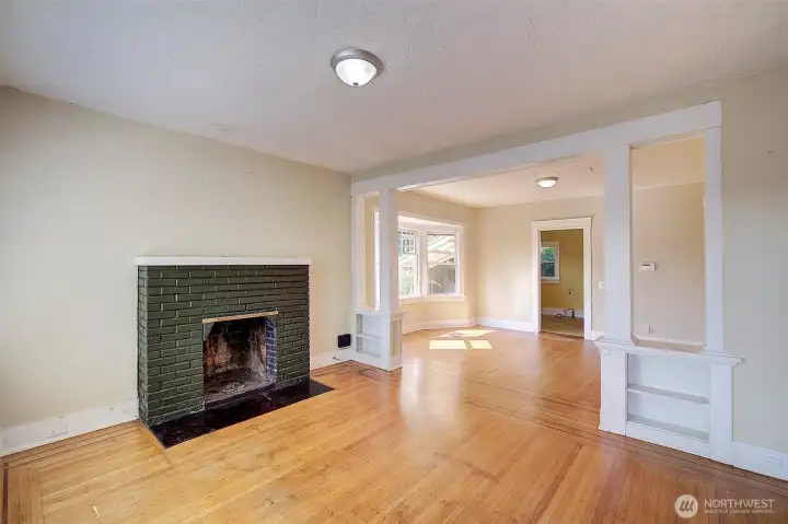 Look at those gorgeous built ins between the living and dining room.