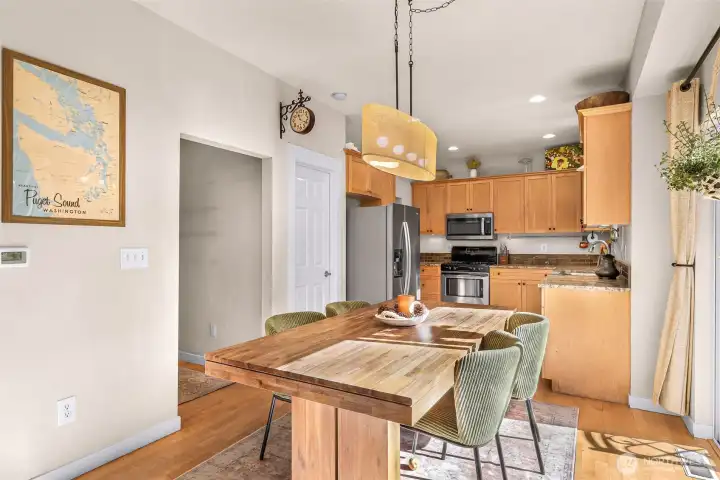 Dining area centrally located between the living room and the kitchen