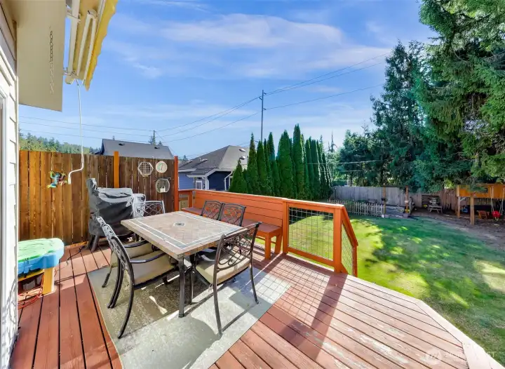 Nice deck off the back with nicely maintained fence yard.
