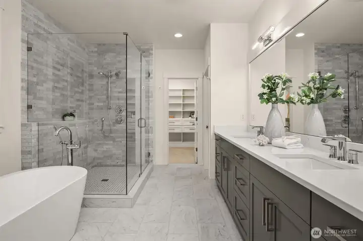 Primary Suite Bath has a large free standing tub & walk-in Shower.