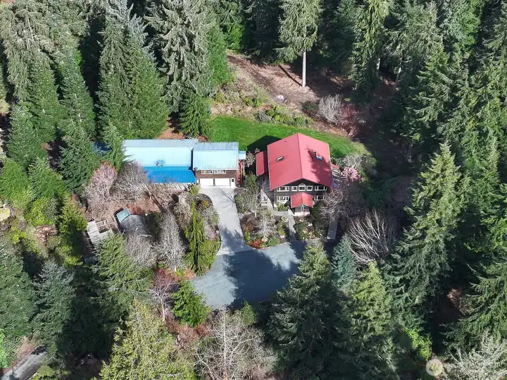 Overhead of the home and outbuildings located a bit off center of   the 8.29 acres.