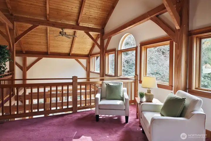 Sitting in the glowing warmth of the home you experience views of the gorgeous multi-acre garden out the many windows.