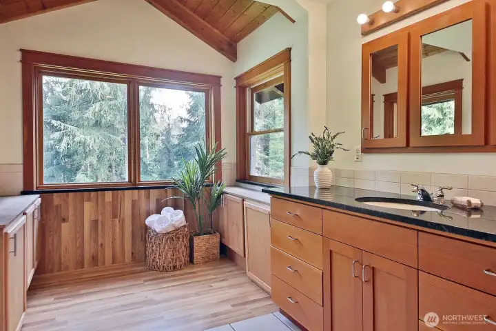 A bath with a view out over the lower gardens. Originally there was a large hot tub in the window nook. The plumbing remains in the floor.