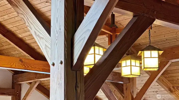 Timber framing is a majestic type of construction that utilizes exacting variations of mortise-and-tenon joinery and massive timbers to form the framework. The joints are secured with wooden pegs — no metal fasteners are used. The exposed fir timbers blend function and beauty creating stunning and unforgettable visual effects.