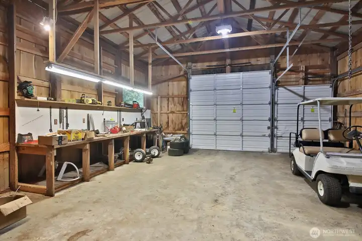 This portion of the shop is approximately 26'8" x 23'7" and has two roll up doors to accommodate an RV, farm equipment, or toys. This was a metal shop.