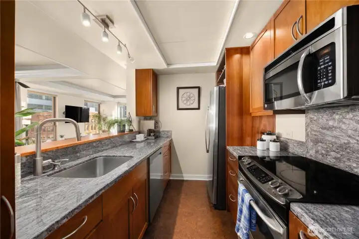 Easy flow updated kitchen, light and bright with bar top pass through.